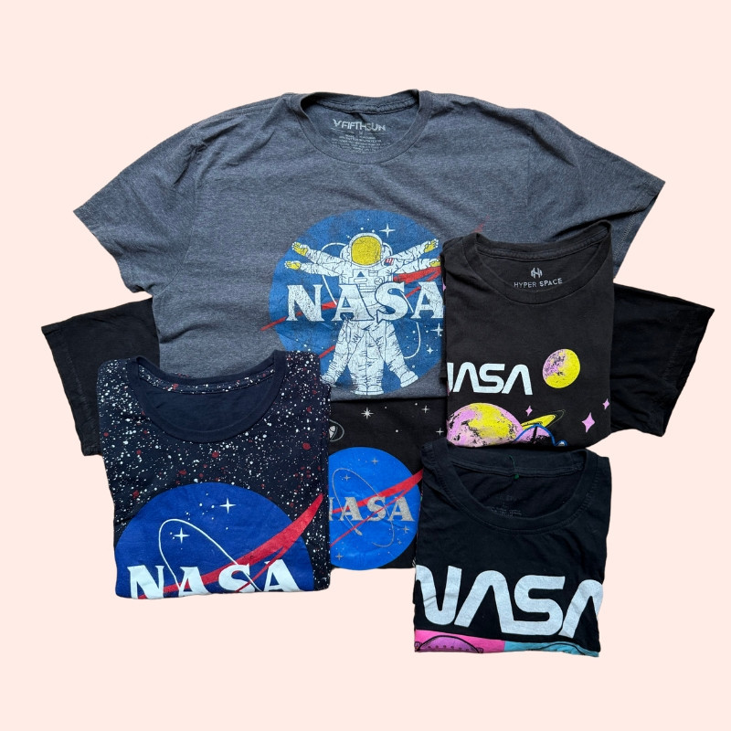 Collection of vintage and preloved NASA t-shirts with retro space-themed graphics and logos. Collection of vintage and preloved NASA t-shirts with retro space-themed graphics and logos.
